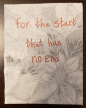 the front of a miniature book with laced-on boards